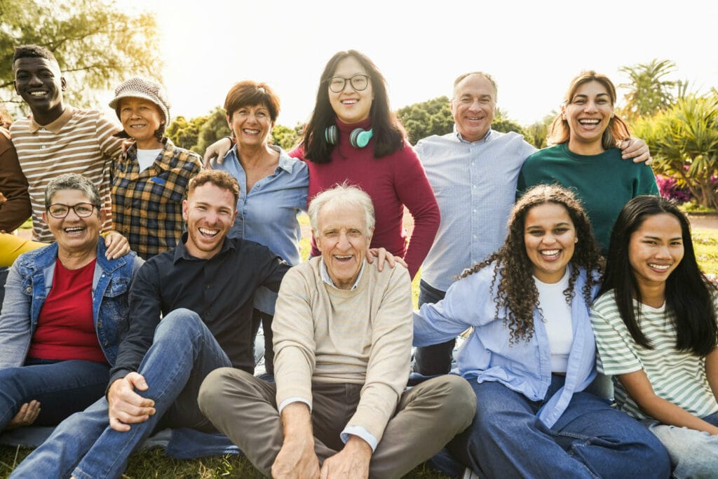 Group of people sitting together smiling